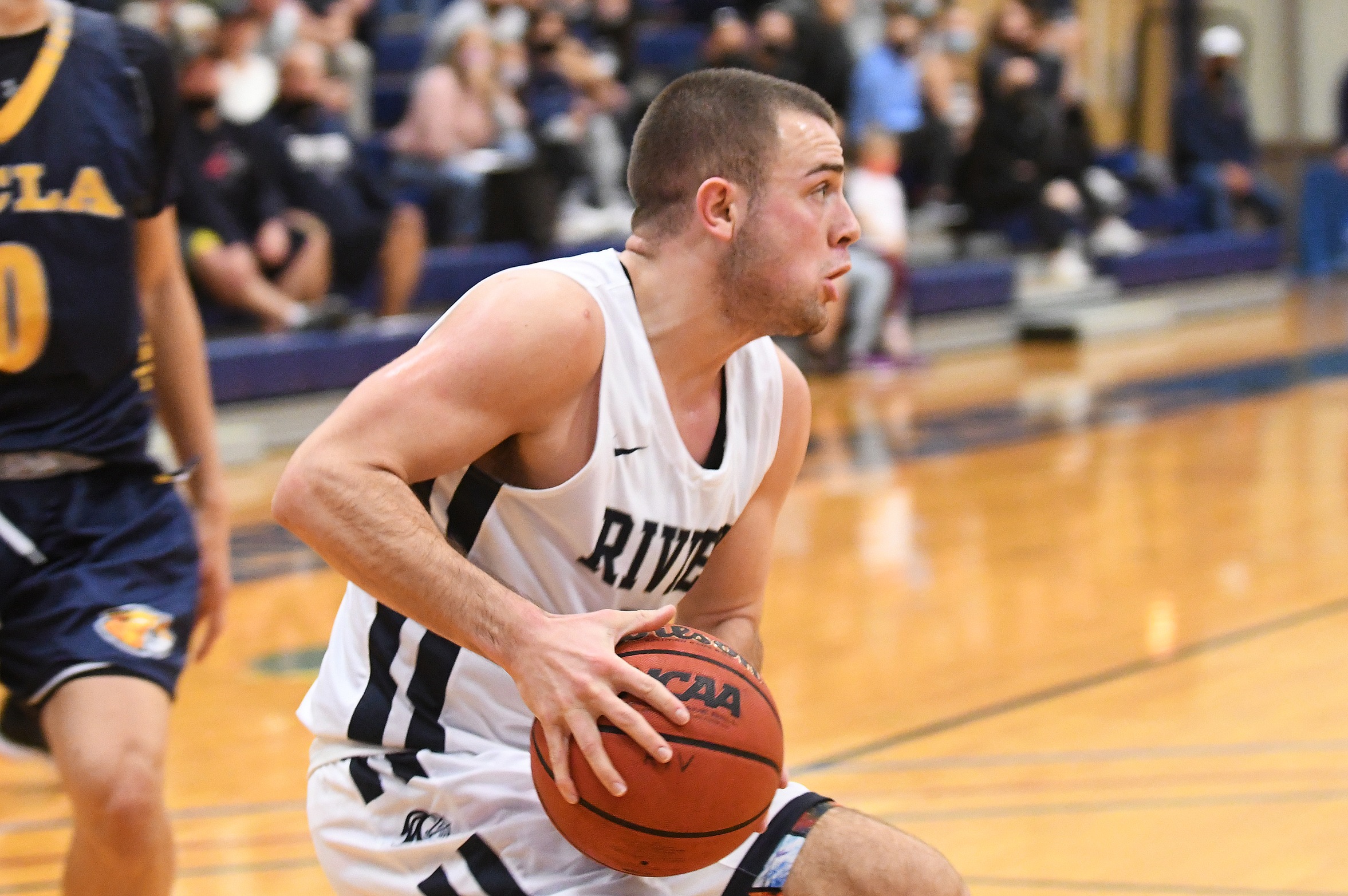 Men’s Basketball Downed by Lasell in Conference Opener
